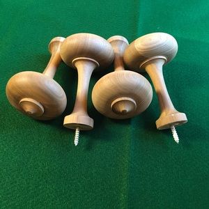 Walnut curtain hold backs.